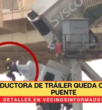 Conductora de tráiler queda colgada de puente